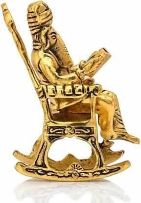 Golden Lord Ganesha Statue Sitting On A Rocking Chair And Reading Ramayan Showpiece